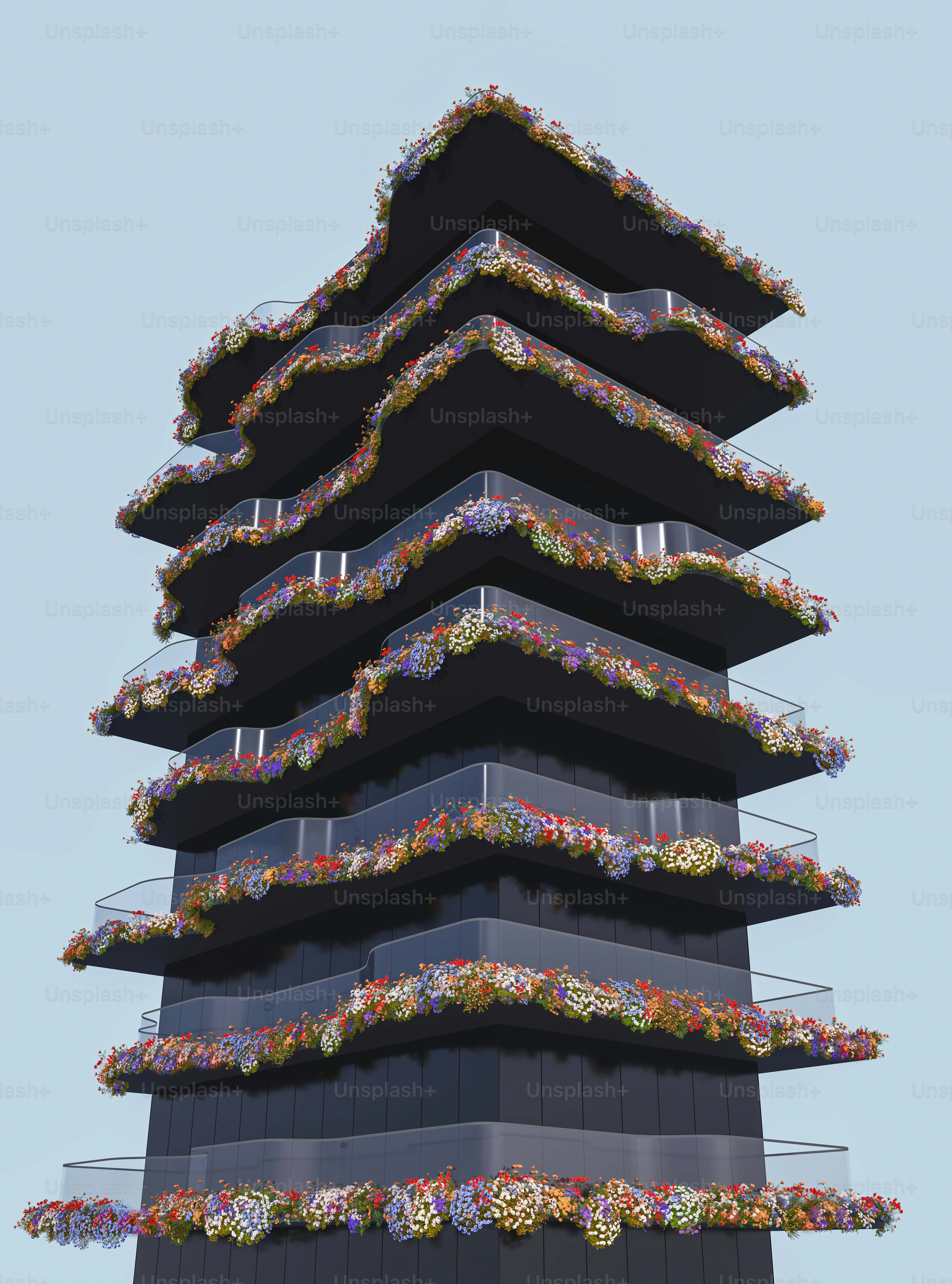a tall tower with a bunch of flowers on it